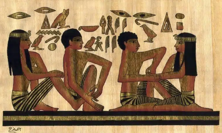 Ancient Egyptian painting depicting four people sitting on the ground, possibly engaging in early forms of massage therapy, with hieroglyphs above them on a papyrus background.