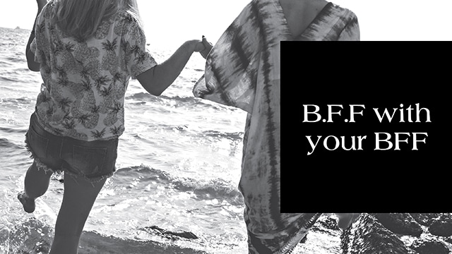 Two people holding hands and walking along the shore, with the text "B.F.F with your BFF" and a special Black Friday Sale Singapore offer displayed in a black box on the right.
