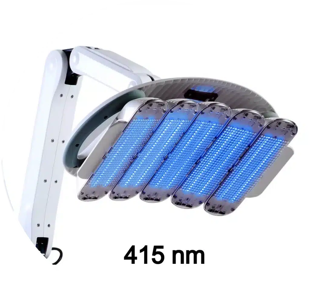 A close-up of a blue LED light therapy device labelled "415 nm," mounted on a white adjustable arm, often used for back acne treatment.
