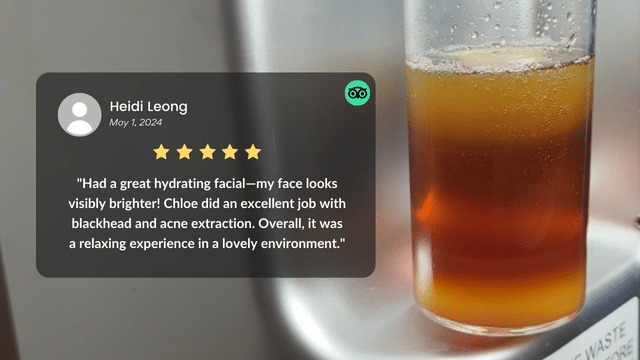 A container with a dark liquid is next to a review praising the hydrafacial treatment, highlighting effective blackhead and acne extraction.