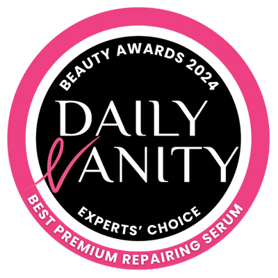 Circular badge with "Beauty Awards 2024," "Daily Vanity," "Experts' Choice," and "Best Premium Repairing Serum" in pink and white text, reminiscent of the renewing effects of an onsen facial.