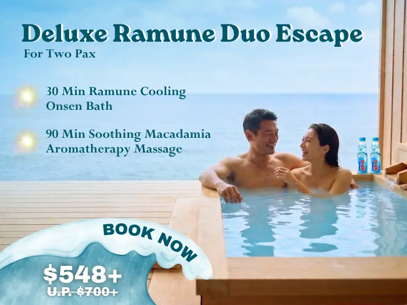 A smiling couple relaxes in an outdoor onsen bath with sea views, showcasing the "Deluxe Ramune Duo Escape" summer spa promotion for two at £548+, including massage and a refreshing ramune bath.