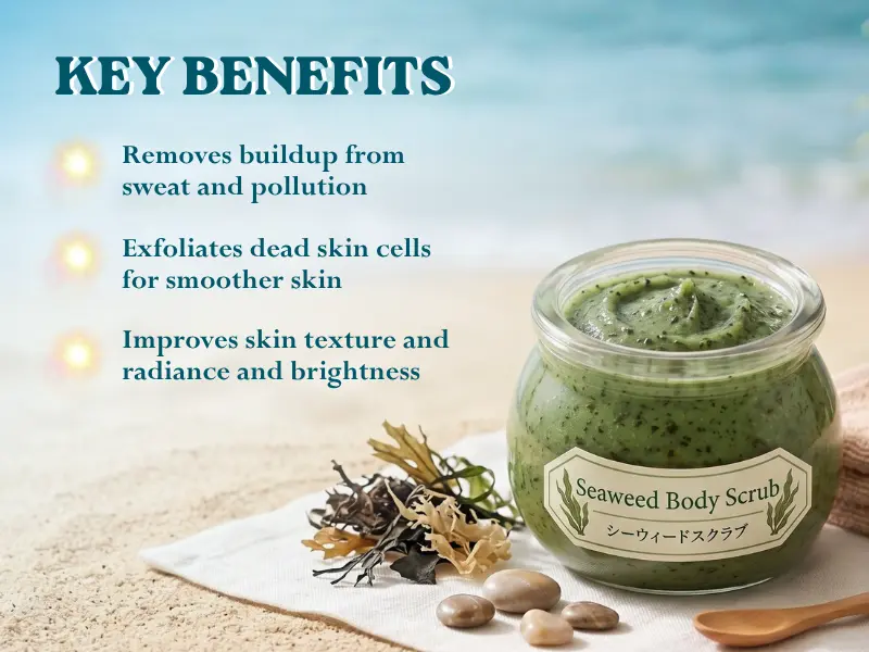 A jar of seaweed body scrub on sand next to seaweed and stones, with text listing benefits like exfoliation and improved skin texture
