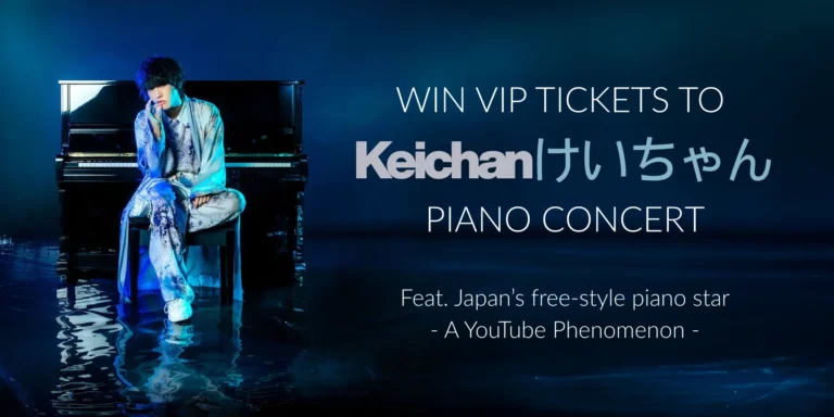 A man in a silver suit sits at a black piano on a reflective blue surface; text promotes a chance to win VIP tickets to Keichan piano concert.
