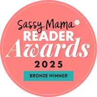 A circular badge with the text “Sassy Mama Reader Awards 2025 Bronze Winner” on a pink background.