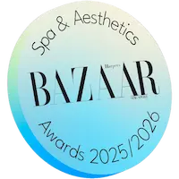 A circular badge displays "Spa & Aesthetics Harper’s BAZAAR Awards 2025/2026" in black text on a light gradient background.