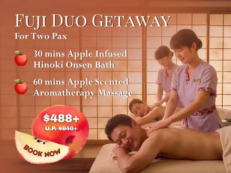 Two people receive massages from therapists in a spa room with elegant Japanese décor. Text highlights one of the best Spa Deals: the Fuji Duo Getaway package, featuring a luxurious Fuji Apple-infused bath and a soothing aromatherapy massage for £488 for two people.