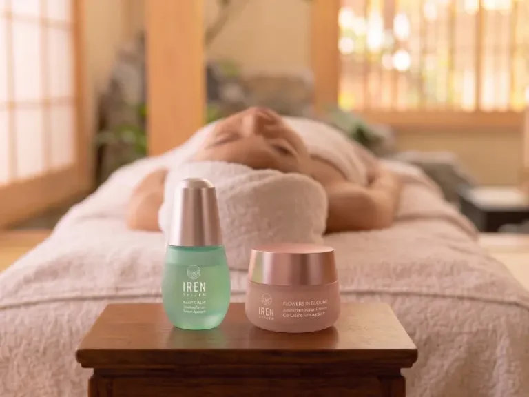A person lies on a massage table in a spa setting, suggesting a relaxing atmosphere, with two skincare products—perfect for a kids' facial—displayed on a small wooden table in the foreground.